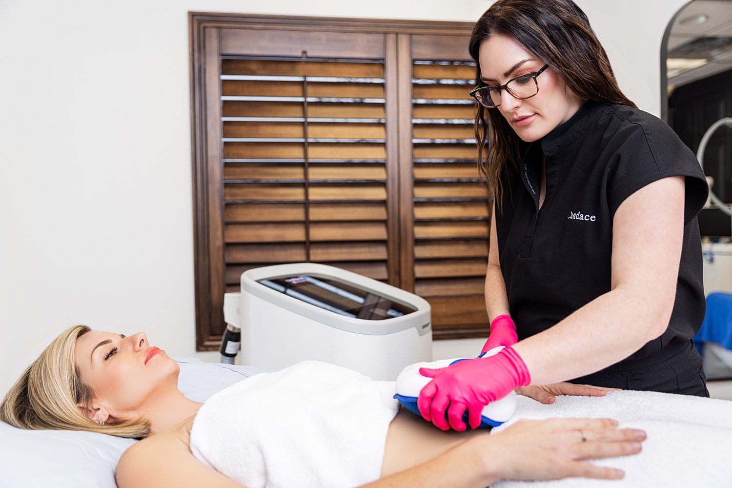 Fitness model in activewear, confident pose.