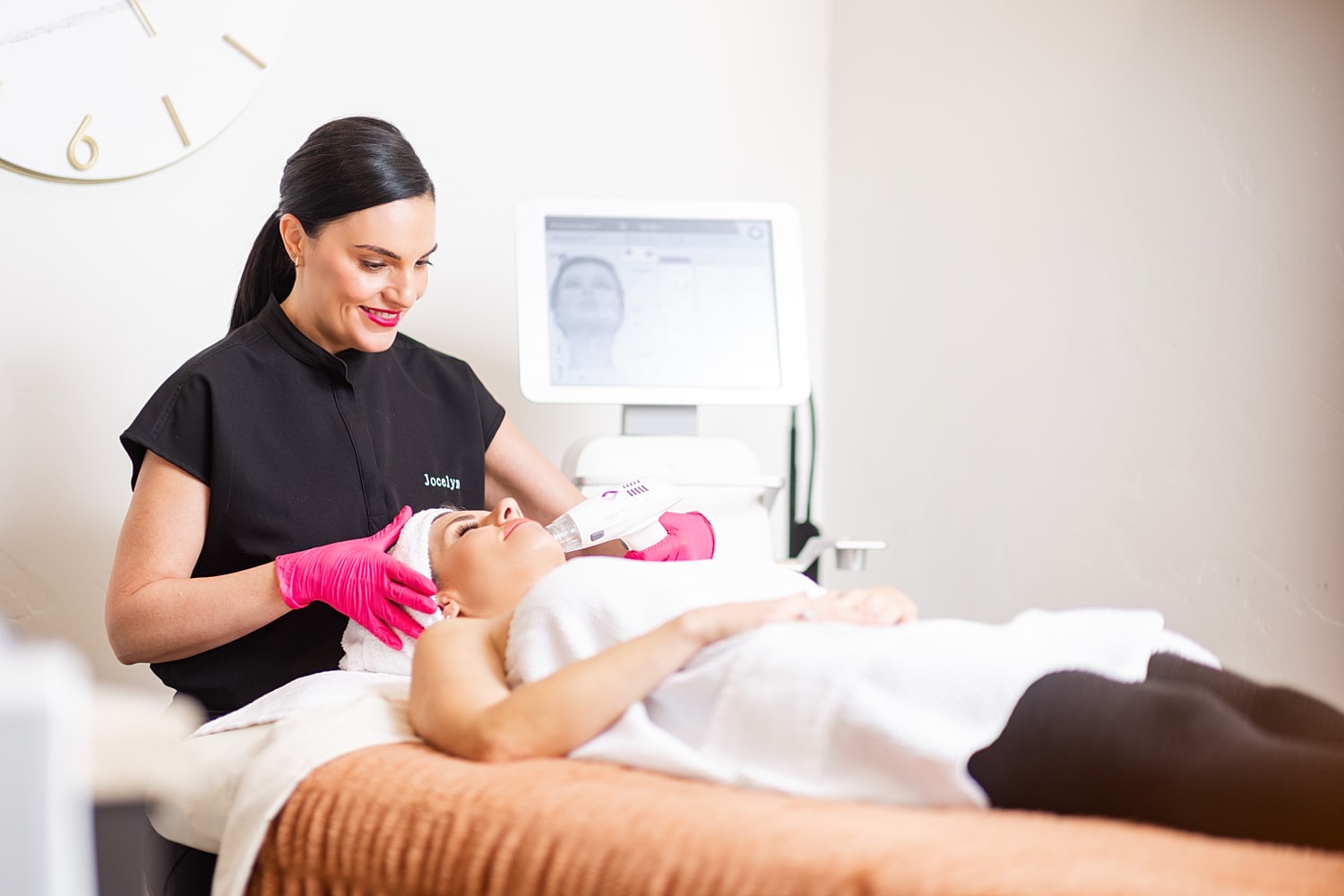Smiling woman with blonde hair in casual attire.