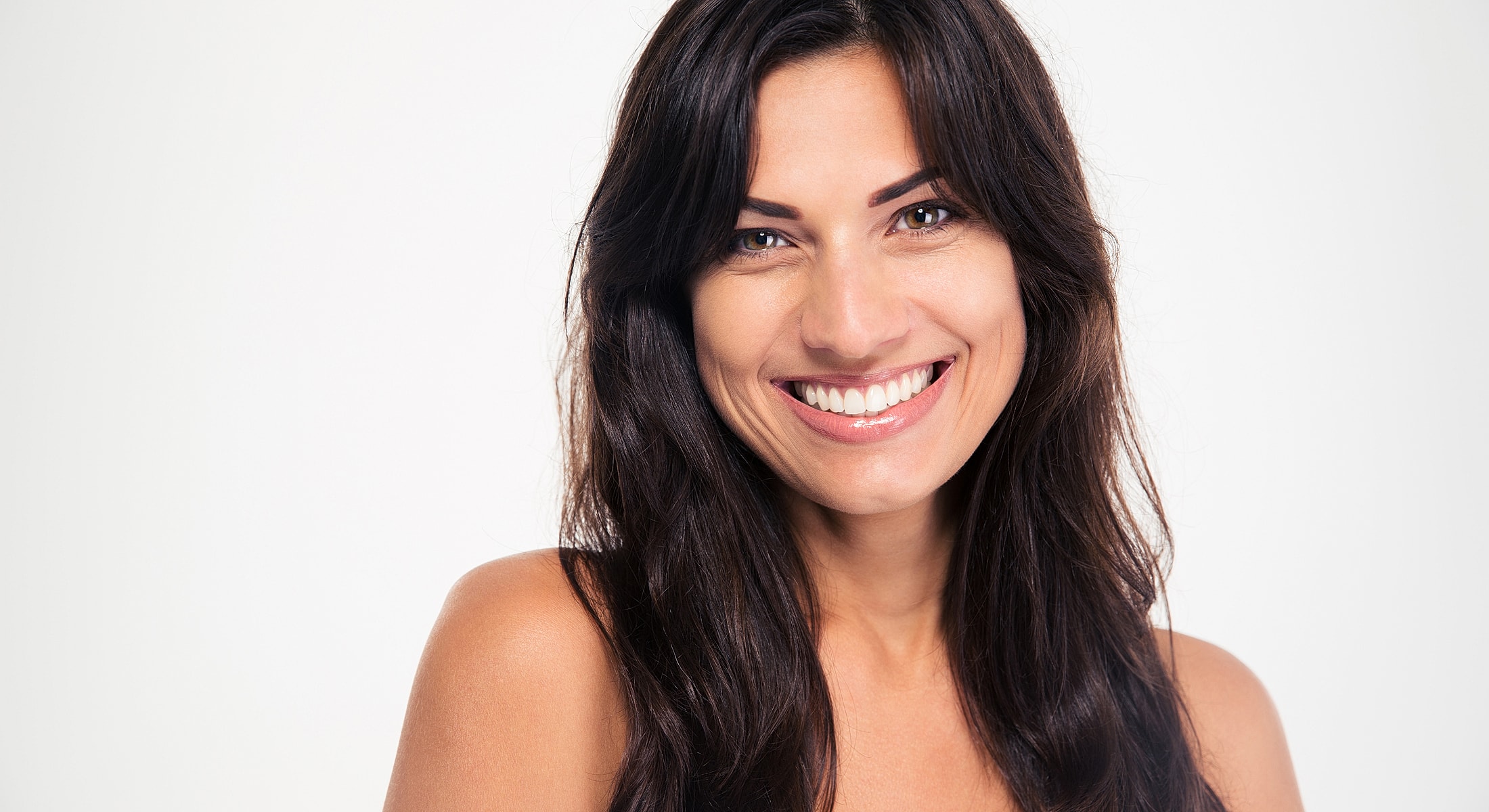 Smiling woman with long dark hair.